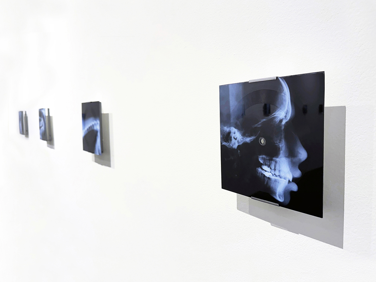 Richard Humann, installation view of original music pressed into polycarbonate flex discs, ink on paper, steel, 7.5" x 7.5". Courtesy of the artist and Leonovich Gallery.